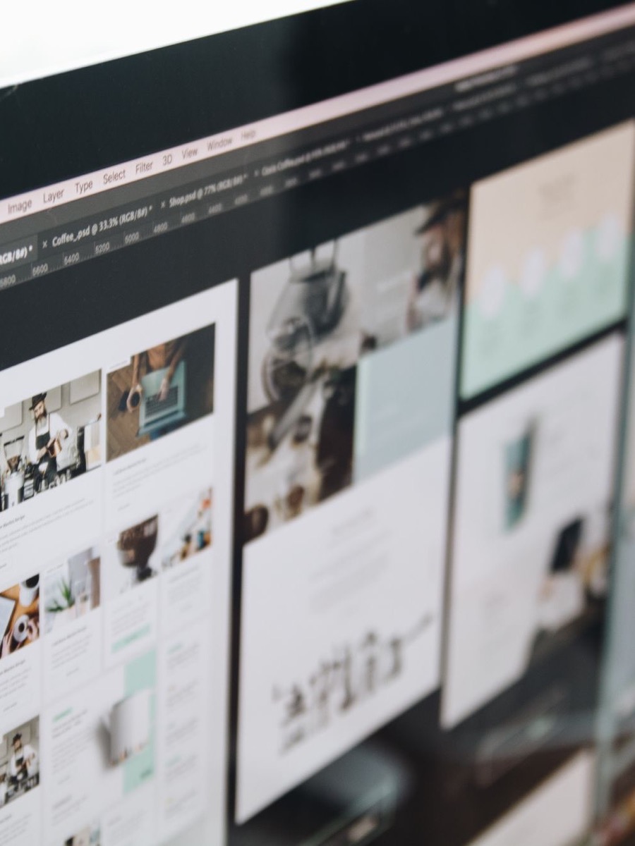 Web design layout being crafted on a desktop screen
